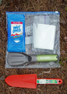 Carry a kit like this in your backpack whenever you head for the woods. The orange plastic trowel is cheap and light, the “iPood” trowel is sturdier and more compact.