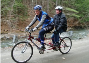 One L-O-N-G steep hill is no match for two really determined pedalers who work together to overcome the challenge. Captain Diana Hanks relies on her “Turbocharger “ Dennis Bilodeau to help pedal to the top on a Vermont dirt road.