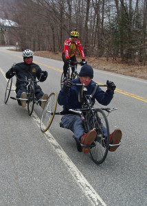 Geoff Krill, the winter sports director at New England Disabled Sports (603-745-628; www.nedisabledsports.org) and Cameron Shaw-Doran (front) roll out their handcycles. Being paralyzed from the waist down hasn’t stopped them from getting out and enjoying the outdoors.