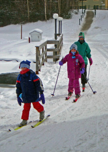 Someone dressed these youngsters  right for a  bitter day at Waterville Valley in New Hampshire: Hats? Check! Face protection? Check! Warm mittens? Check! Big smiles? Hard to see but I’m sure they are there.