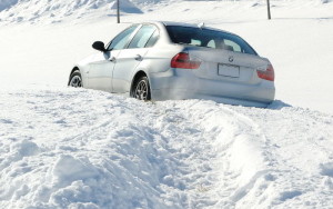 It's a bummer when your Bimmer is in a (snow)bank...but if you're prepared, at least you won't hate the wait for AAA! (TireRack photo)