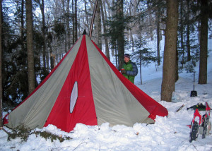 I know his smile looks like a grimace, but David Shedd and I were actually having fun on this winter camping expedition to New Hampshire's White Mountain National Forest. The temperature dropped below zero at night (it was still below zero when this photo was taken) but the woodstove and good sleeping bags kept us warm and comfy--most of the time! (Tim Jones photo)
