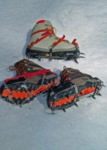 Clockwise from top are serious mountaineering crampons,  less weighty and cumbersome  are the modern, flexible Kahtoola KTS steel crampons, and, most versatile for trail hiking, Kahtoola MICROspike creepers.